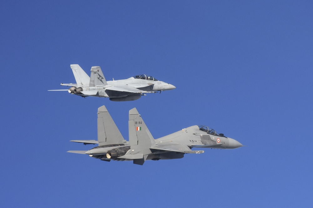 An F/A-18F Super Hornet from Number 1 Squadron flys in formation with a SU-30MKI Flanker from the Indian Air Force during Exercise Pitch Black 18 *** Local Caption *** Exercise Pitch Black is the Royal Australian Air Forces largest and most complex exercise. Pitch Black 2018 is being conducted at RAAF Bases Darwin and Tindal from 27 July until 18 August. 