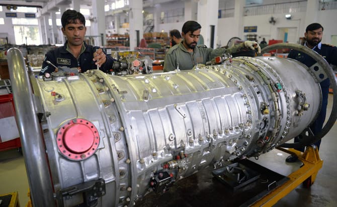 Technicians work on a Mirage aircraft during a full overhaul by the Pakistan Air Force (PAF) at the Mirage Rebuild Factory (MRF) in Kamra