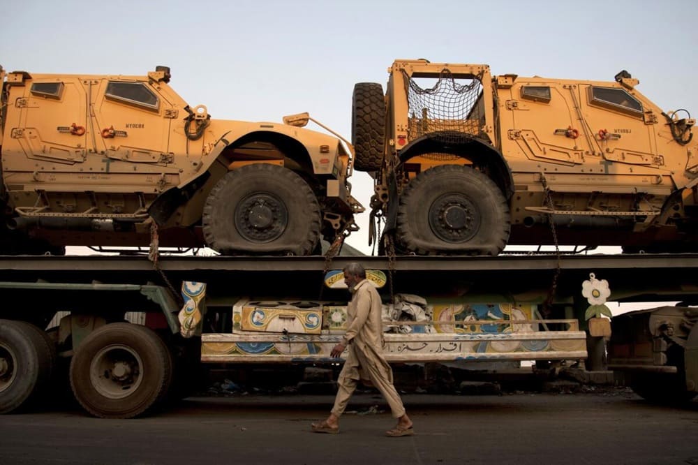 A truck carrying NATO military vehicles at a terminal in Karachi, Pakistan, in November, when demonstrators began interfering with supply routes to Afghanistan.